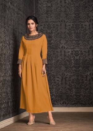 Celebrate This Festive Season With Beauty And Comfort Wearing This Designer Readymade Kurti In Musturd Yellow Color Fabricated On Rayon. It Is Beautified With Fancy Lace Border And Light In Weight And Easy To Carry All Day Long. 