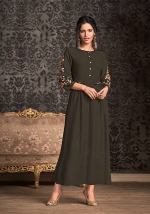 Enhance Your Personality Wearing This Designer Readymade Lonf Kurti In Dark Brown Color Fabricated On Rayon. This Kurti Is Beautified With Thread Work Over The Sleevs Giving It An Attractive Look. Buy Now.
