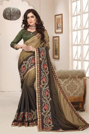Shaded Saree Can Never Go Out Of Style, So Grab This Very Beautiful Shaded Saree In Dark Green And Olive Green Color Paired With Dark Green Colored Blouse. This Saree Is Fabricated On Soft Silk Paired With Art Silk Fabricated Blouse. It Is Beautified With Attractive Contrasting Embroidery Giving It A More Attractive Look. Buy Now.
