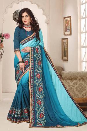 Shaded Saree Can Never Go Out Of Style, So Grab This Very Beautiful Shaded Saree In Light Blue And Blue Color Paired With Blue Colored Blouse. This Saree Is Fabricated On Soft Silk Paired With Art Silk Fabricated Blouse. It Is Beautified With Attractive Contrasting Embroidery Giving It A More Attractive Look. Buy Now.
