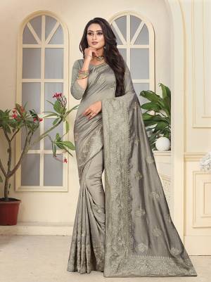 Rich And Elegant Looking Heavy Designer Saree Is Here In Grey Color Paired With Grey Colored Blouse. This Saree And Blouse Silk Based Which Gives A Rich Look To Your Personality. Buy This Heavy Saree Now.