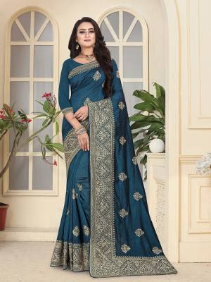 Get Ready For The Upcoming Festive And Wedding Season With This Heavy Designer Saree In Prussian Blue Color. This Pretty Saree And Blouse are Fabricated On Soft Art Silk Beautified With Jari Embroidery and Stone Work. 