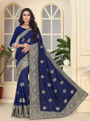 Add This Very Pretty Heavy Embroidered Designer Saree To Your Wardrobe In Navy Blue Color Paired With Navy Blue Colored Blouse. This Saree And Blouse Are Fabricated On Soft Art Silk Beautified With Heavy Jari Embroidery And Stone Work. 