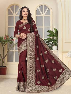 Add This Very Pretty Heavy Embroidered Designer Saree To Your Wardrobe In Dark Maroon Color Paired With Dark Maroon Colored Blouse. This Saree And Blouse Are Fabricated On Soft Art Silk Beautified With Heavy Jari Embroidery And Stone Work. 
