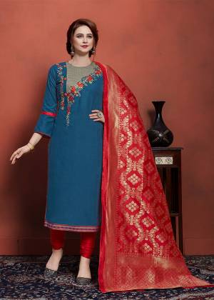 To Give A Heavy Look, Grab This Designer Straight Suit In Blue Colored Top With Heavy Embroidery Over Neckline Paired With Contrasting Red Colored Bottom And Dupatta. This Dress Material Is Cotton Based Paired With Banarasi Art Silk Dupatta. 