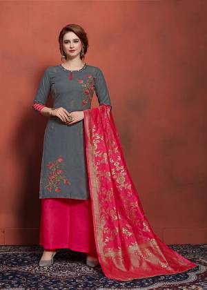 Flaunt Your Rich And Elegant Taste Wearing This Designer Straight Suit In Grey Colored Top Paired With Contrasting Rani Pink Colored Bottom And Dupatta. This Dress Material IS Cotton Based Paired With Banarasi Art Silk Dupatta. It Is Light In Weight And Easy To Carry All Day Long. 