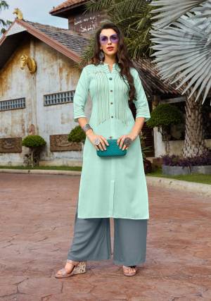 Pretty Unique Color Pallete Is Here With This Designer Readymade Set Of Kurti And Plazzo In Aqua Blue And Grey Color Respectively. Its Top Is Cotton Based Paired With Rayon Fabricated Bottom. Both The Fabrics Are Light Weight And Durable. Buy Now.