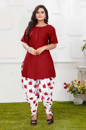 Grab This Pretty Pair Of Readymade Kurti And Dhoti In Red And White Color. This Kurti Is Fabricated On Rayon Slub Paired With Crepe Fabricated Digital Printed Dhoti. It Is Available In All Regular Sizes And Ensures superb Comfort All Day Long. Buy Now.