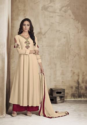Adorn The Latest Wearing This Designer Readymade Long Suit In Cream Color Paired With Maroon Colored Plazzo And Cream Colored Dupatta. Its Top And Bottom Are Fabricated On Muslin Paired With Chiffon Fabricated Dupatta. This Suit IS Fully Stitched And Available And Multiple Sizes. 