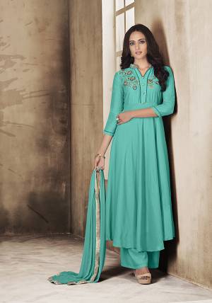 Here Is A Very Pretty Readymade Suit In Turquoise Blue Color For The Upcoming Festive Season. Its Top And Plazzo Are Fabricated On Muslin Paired With Chiffon Fabricated Dupatta. Buy Now.