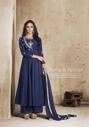 For A Bold And Beautiful Look, Grab This Readymade Designer Plazzo Suit In All over Navy Blue Color. Its Top And Plazzo Are Muslin Based Paired With Chiffon Fabricated Dupatta. This New Trending Pattern In Long Top With Plazzo Will Definitely Earn You Lots Of Compliments From Onlookers.