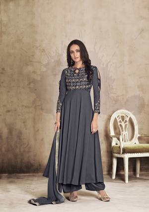 For A Bold And Beautiful Look, Grab This Readymade Designer Plazzo Suit In All over Dark Grey Color. Its Top And Plazzo Are Muslin Based Paired With Chiffon Fabricated Dupatta. This New Trending Pattern In Long Top With Plazzo Will Definitely Earn You Lots Of Compliments From Onlookers.