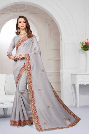 Grab This Very Beautiful Designer Saree In Grey Color For The Upcoming Festive And Wedding Season. This Saree And Blouse Are Fabricated On Cotton Silk Beautified With Heavy Embroidered Lace Border And Butti. Its Rich Fabric And Color Will Earn You Lots Of Compliments From Onlookers. 