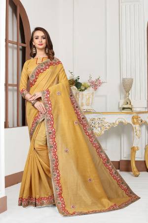 Grab This Very Beautiful Designer Saree In Grey Color For The Upcoming Festive And Wedding Season. This Saree And Blouse Are Fabricated On Cotton Silk Beautified With Heavy Embroidered Lace Border And Butti. Its Rich Fabric And Color Will Earn You Lots Of Compliments From Onlookers. 