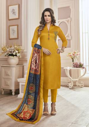 Add This Very Beautiful Designer Straight Suit To Your Wardrobe With Fully Stitched Top And Unstitched Bottom. This Pretty Cotton Based Suit Is In Musturd Yellow Color Paired With Multi Colored Muslin Fabricated Dupatta. Buy This Now.