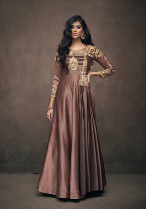 You Will Definitely Earn Lots Of Compliments Wearing This Designer Readymade Gown In Brown Color Fabricated On Satin Silk. Its Rich Fabric And Color Will Give You Look Like Never Before. 