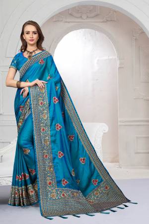 Rich And Elegant Looking Heavy But Subtle Look Designer Saree Is Here In Blue Color. This Pretty Embroidered Saree And Blouse are Fabricated On Satin Silk Beautified With Jari And Resham Work. Its Rich Fabric And Color Will Definitely Earn You Lots Of Compliments From Onlookers.