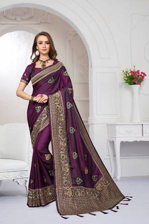Rich And Elegant Looking Heavy But Subtle Look Designer Saree Is Here In Purple Color. This Pretty Embroidered Saree And Blouse are Fabricated On Satin Silk Beautified With Jari And Resham Work. Its Rich Fabric And Color Will Definitely Earn You Lots Of Compliments From Onlookers.