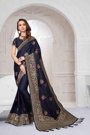 Rich And Elegant Looking Heavy But Subtle Look Designer Saree Is Here In Navy Blue Color. This Pretty Embroidered Saree And Blouse are Fabricated On Satin Silk Beautified With Jari And Resham Work. Its Rich Fabric And Color Will Definitely Earn You Lots Of Compliments From Onlookers.
