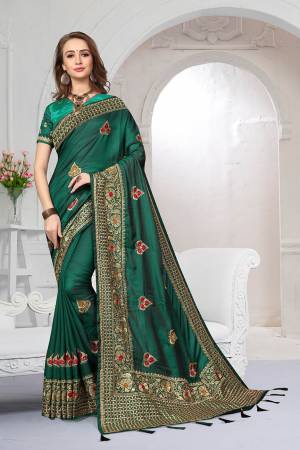 Rich And Elegant Looking Heavy But Subtle Look Designer Saree Is Here In Pine Green Color. This Pretty Embroidered Saree And Blouse are Fabricated On Satin Silk Beautified With Jari And Resham Work. Its Rich Fabric And Color Will Definitely Earn You Lots Of Compliments From Onlookers.