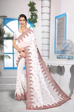 Simple And Elegant Looking Designer Saree With Attractive Kashmiri Work IS Here In White Color. This Saree and Blouse are Georgette Based Beautified With Detailed Embroidery Giving It An Attractive Look. 