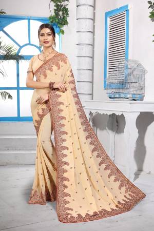 Simple And Elegant Looking Designer Saree With Attractive Kashmiri Work IS Here In Cream Color. This Saree and Blouse are Georgette Based Beautified With Detailed Embroidery Giving It An Attractive Look. 