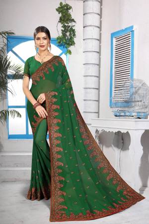 Simple And Elegant Looking Designer Saree With Attractive Kashmiri Work IS Here In Green Color. This Saree and Blouse are Georgette Based Beautified With Detailed Embroidery Giving It An Attractive Look. 