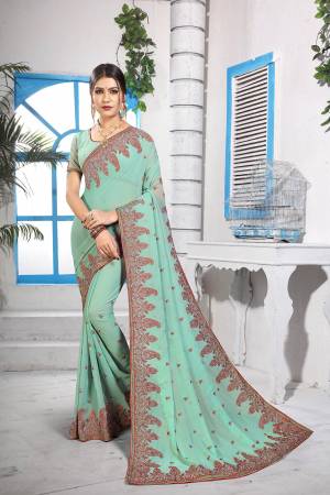 Grab This Very Beautiful Heavy Kashmiri Work Designer Saree In Pastel Green Color. This Saree And Blouse are Fabricated On Georgette Beautified With Heavy Kashmiri Embroidery With Resham And Stone. Buy Now.