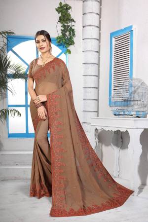 Simple And Elegant Looking Designer Saree With Attractive Kashmiri Work IS Here In Light Brown Color. This Saree and Blouse are Georgette Based Beautified With Detailed Embroidery Giving It An Attractive Look. 