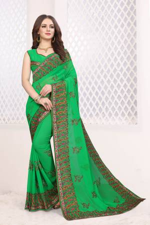 Grab This Very Beautiful Heavy Kashmiri Work Designer Saree In Green Color. This Saree And Blouse are Fabricated On Georgette Beautified With Heavy Kashmiri Embroidery With Resham And Stone. Buy Now.