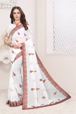 Grab This Very Beautiful Heavy Kashmiri Work Designer Saree In White Color. This Saree And Blouse are Fabricated On Georgette Beautified With Heavy Kashmiri Embroidery With Resham And Stone. Buy Now.