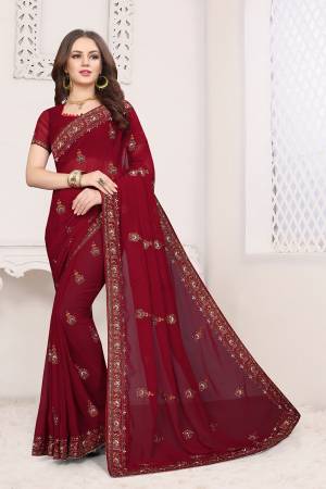 Simple And Elegant Looking Designer Saree With Attractive Kashmiri Work IS Here Maroon Color. This Saree and Blouse are Georgette Based Beautified With Detailed Embroidery Giving It An Attractive Look. 