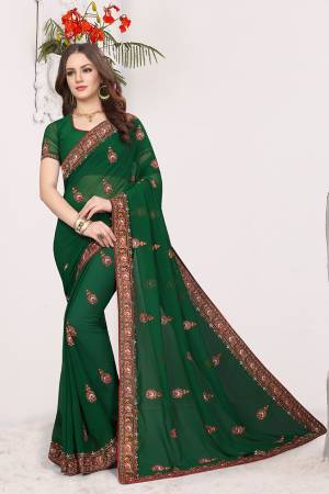 Grab This Very Beautiful Heavy Kashmiri Work Designer Saree In Dark Green Color. This Saree And Blouse are Fabricated On Georgette Beautified With Heavy Kashmiri Embroidery With Resham And Stone. Buy Now.
