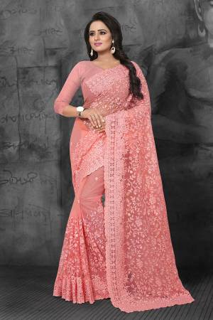 Look Pretty In This Very Beautiful Designer Net Based Saree In Pink Color. This Pretty Saree And Blouse Are Beautified With Tone To Tone Resham And Ceramic Stone Work. Buy Now.