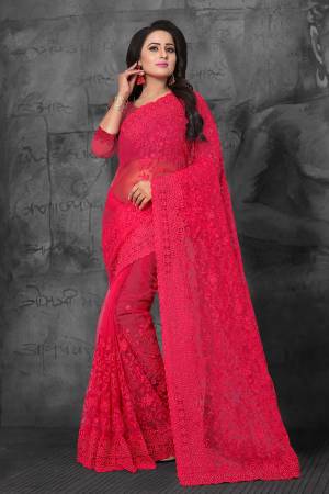 Bright And Appealing Color Is Here With This Heavy Designer Saree In Dark Pink Color. This Saree and Blouse are Fabricated On Net Beautified With Tone To Tone Resham Embroidery And Ceramic Stone Work. It Is Easy To Drape And Carry Throughout The Gala.