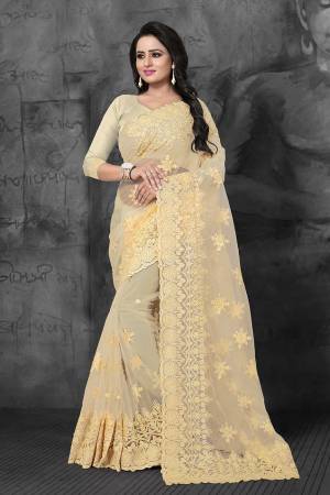 Look Pretty In This Very Beautiful Designer Net Based Saree In Light Yellow Color. This Pretty Saree And Blouse Are Beautified With Tone To Tone Resham And Ceramic Stone Work. Buy Now.