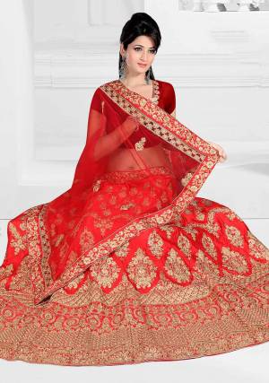 Get Ready For Your D-Day With This Very Beautiful And Evergreen Color For A Bridal Wear With This Designer Lehenga Choli In Red Color. This Heavy Embroidered Lehenga Choli Is Satin Silk Based Paired With Net Fabricated Dupatta. Its Lovely Bright Color And Heavy Embroidery Will Add Pretty Glam Look.