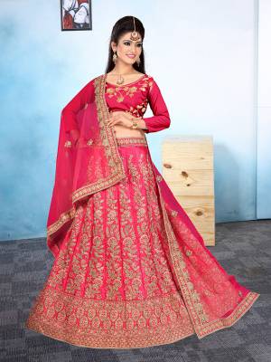 Here Is A Very Beautiful Heavy Designer Bridal Lehenga Choli In All Over Dark Pink. Its Blouse And Lehenga Are Fabricated On Satin Silk Paired With Net Fabricated Dupatta. It Is Beautified With Heavy Embroidery Giving It An Attractive Look. 