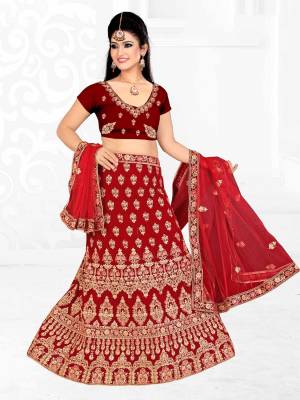 Here Is A Very Beautiful Heavy Designer Bridal Lehenga Choli In All Over Maroon Color. Its Blouse And Lehenga Are Fabricated On Satin Silk Paired With Net Fabricated Dupatta. It Is Beautified With Heavy Embroidery Giving It An Attractive Look. 