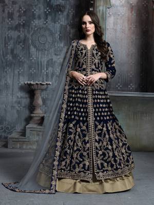 Here Is A Very Pretty Designer Indo-Western Suit In Navy Blue Colored Top Paired With Beige Colored Bottom And Light Green Colored Dupatta. Its Heavy Embroidered Top Is Fabricated On Velvet Paired With Tafeta Art Silk Bottom And Net Fabricated Dupaata. Buy This Lehenga Suit Now.