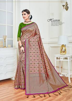 For An Attractive Festive Look, Grab This Designer Silk Based Saree In Rose Gold Color Paired With Contrasting Green Colored Blouse. This Saree And Blouse silk Based Beautified With Intricate Weave. 