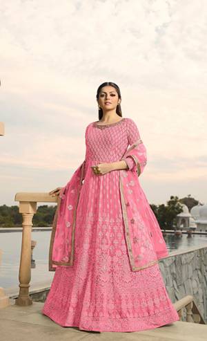 Look The Most Prettiest Of All Wearing This Designer Floor Length Suit In All Over Pink Color. Its Heavy Embroidered Top Is Fabricated On Georgette Paired With Santoon Bottom And Net Fabricated Dupatta. Its Fabrics And Embroidery are light Weight And Ensures Superb Comfort All Day Long. 