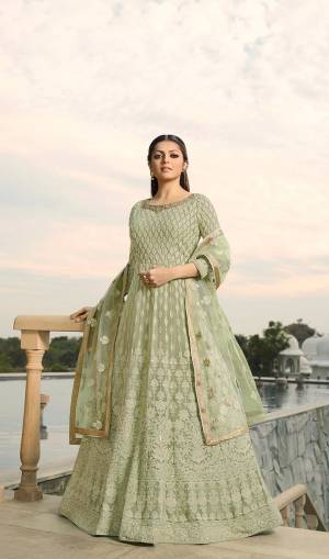 Look The Most Prettiest Of All Wearing This Designer Floor Length Suit In All Over Pastel Green Color. Its Heavy Embroidered Top Is Fabricated On Georgette Paired With Santoon Bottom And Net Fabricated Dupatta. Its Fabrics And Embroidery are light Weight And Ensures Superb Comfort All Day Long. 