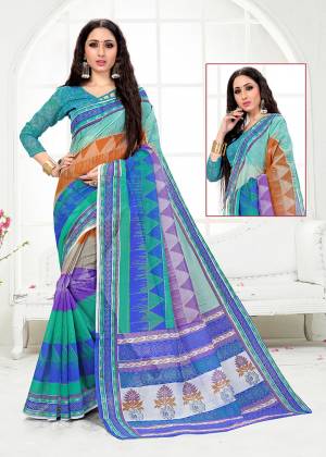 Add Some Casuals With This Very Pretty Saree In Blue Color. This Saree And Blouse are Fabricated On Cotton Beautified With Prints All Over. Its Fabric Is Light In Weight And Easy To Carry All Day Long. 