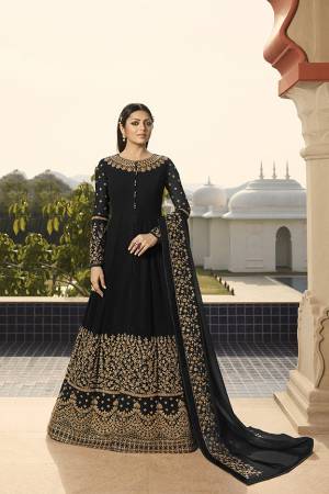 Enhance Your Personality Wearing This Heavy Designer Floor Length Suit In All Over Black Color. This Rich Pattern And Heavy Embroidery Will Give You Look Like Never Before. Its Heavy Embroidered Top And Dupatta Are Fabricated On Georgette Paired With Santoon Fabricated Bottom. 