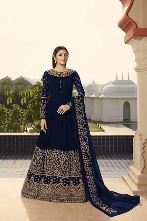Enhance Your Personality Wearing This Heavy Designer Floor Length Suit In All Over Navy Blue Color. This Rich Pattern And Heavy Embroidery Will Give You Look Like Never Before. Its Heavy Embroidered Top And Dupatta Are Fabricated On Georgette Paired With Santoon Fabricated Bottom. 