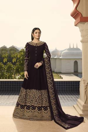 Enhance Your Personality Wearing This Heavy Designer Floor Length Suit In All Over Wine Color. This Rich Pattern And Heavy Embroidery Will Give You Look Like Never Before. Its Heavy Embroidered Top And Dupatta Are Fabricated On Georgette Paired With Santoon Fabricated Bottom. 