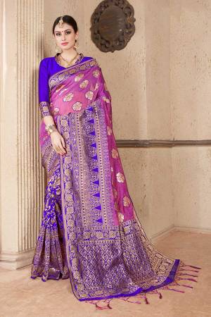 Celebrate This Festive Season Wearing This Designer Silk Based Saree In Pink & Royal Blue Color Paired With Royal Blue Colored Blouse. This Saree And Blouse Are Fabricated On Soft Art Silk Beautified With Weave All Over. 
