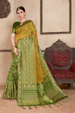 Celebrate This Festive Season Wearing This Designer Silk Based Saree In Olive Green Color Paired With Green Colored Blouse. This Saree And Blouse Are Fabricated On Soft Art Silk Beautified With Weave All Over. 