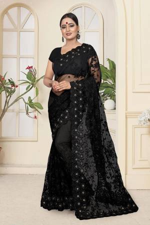 Here Is A Very Beautiful Heavy Embroidered Designer Saree In Black Color. This Saree And Blouse are Fabricated On Net Beautified With Tone To Tone Heavy Resham Embroidery With Ceramic Stone Work. Its Embroidery Gives Heavy And Subtle Look To Your Personality Both At The Same Time